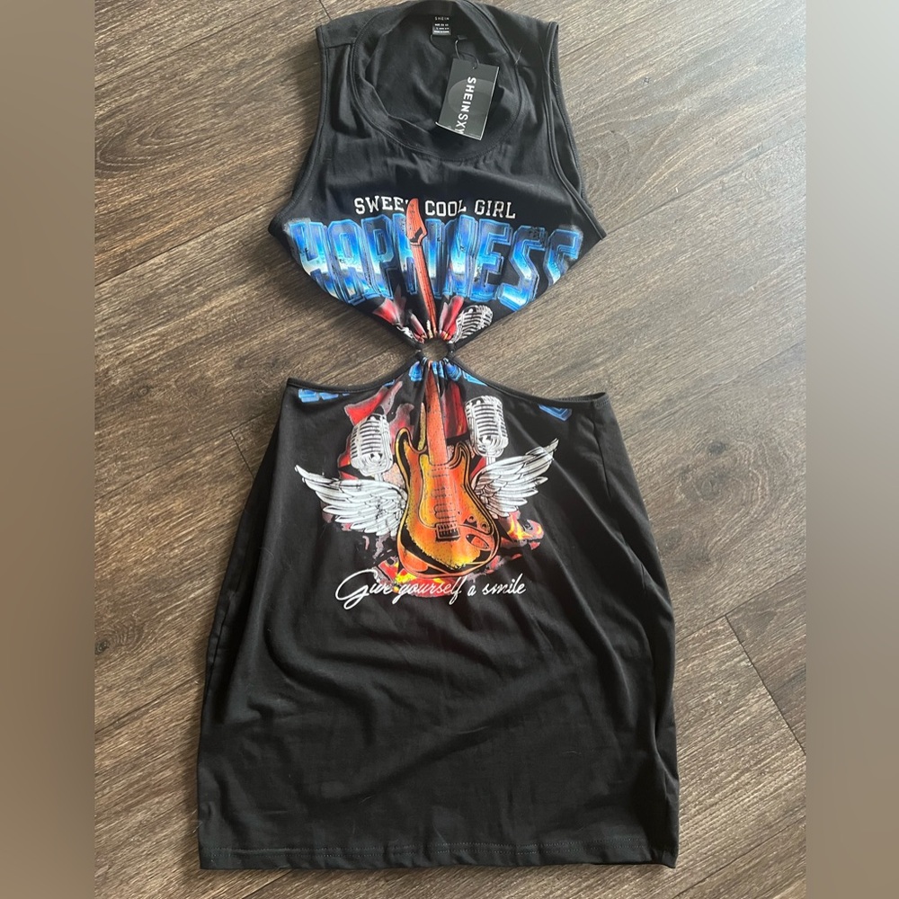 Guitar dress with cut outs. New with tags